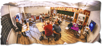 a group of people sitting around a table in a room